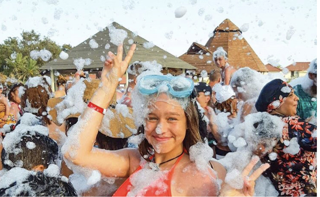 Teen with goggles in foam - Foam O Clock Party Rentals foam party rentals Boulder, CO